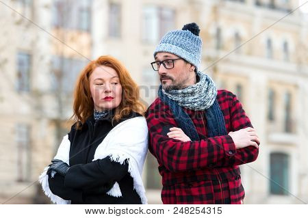 Couple With Crossed Hand On Chest And Lean To Shoulders Looked At Each Other. Urban Couple Disagree.