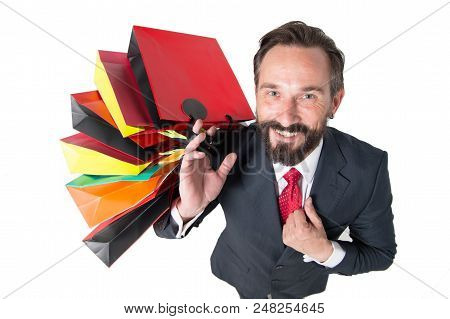Handsome Beaded Man With Lot Of Shopping Bags Top View. Man In Suit Happy From Shopping Time And Pre
