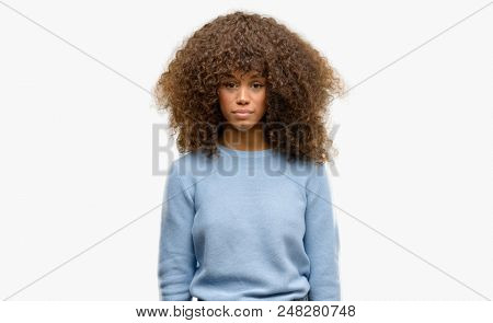 African american woman wearing a sweater depressed and worry for distress, crying angry and afraid. Sad expression.