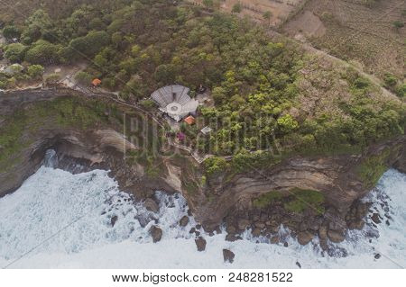 Aerial drone view of temple and beautiful Uluwatu clffs in Bali, Indonesia