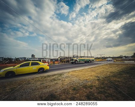Panama City - March 2018: Taxi And Bus Picking Up People At Station Near Airport In Panama City