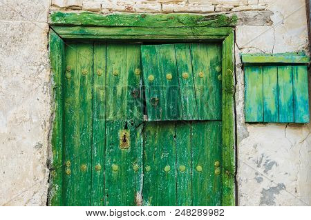 Omodos, Cyprus. May 2018. A Typical View Of An Old Building With Old Doors In The Traditional Villag