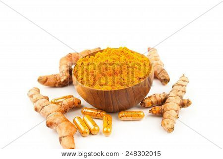 Turmeric Capsules And Turmeric Powder On White Background, Herbal