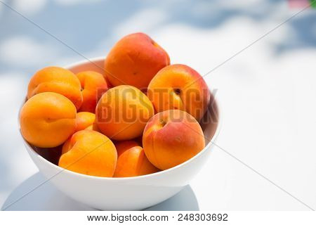 Apricots In A White Bowl On White Background