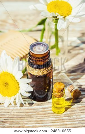 Chamomile Essential Oil. Selective Focus. Butle Little.