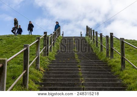 Hoek Van Holland, The Netherlands - April 5, 2018: Children Playing On A Hill With Stairs In Early S