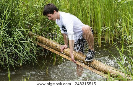 Biddinghuizen, The Netherlands - June 23, 2018: Man During A Mud Run (mudraise, Charity) In The Mud 