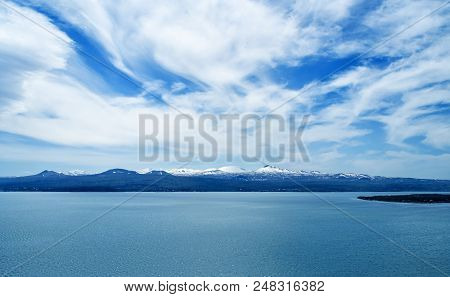 Lake Sevan In Armenia, Beautiful View Of The Lake On A Sunny Bright Spring Day, Beautiful Clouds