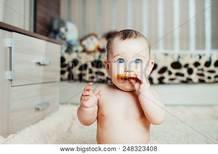 Adorable Baby Eating A Cookie