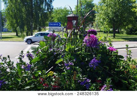 Beautiful Flowers In A Park With Road Sign Pointing To The
Tourist Office ( Turistbyrå ) In Ludvika 
