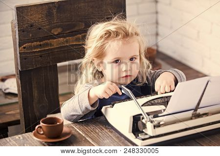 Profession Of A Copywriter. Business Kid Or Small Businessman Child Sitting At Table And Typing Type