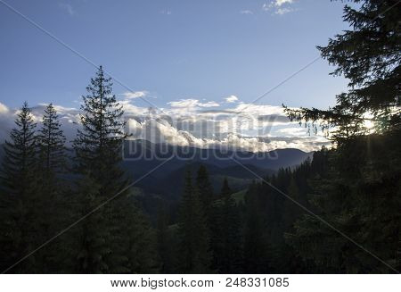 Photo Of Mountain Landscape In The Summer Under Beautiful Cloudy Sky. Ukraine, Carpathians, Dzembron