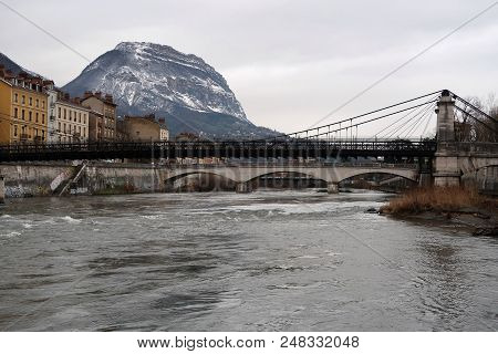 Buildings Of Different Shapes And Colors Along The Isère River In Grenoble, France