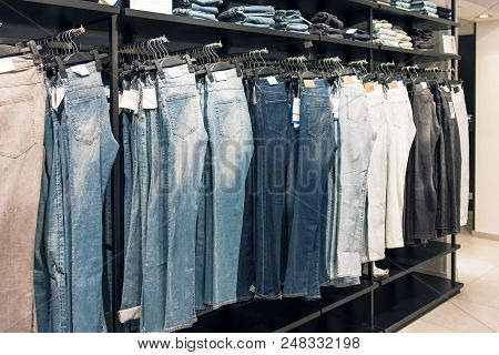 Shop Jeans, Jeans On Hangers On The Counter