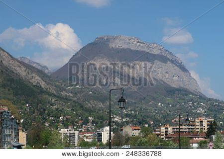 Buildings Of Different Shapes And Colors Along The Isère River In Grenoble, France