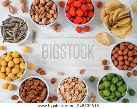 Assortment Of Different Snack For Beer, Wine, Party. Peanuts In Coconut Glaze, Green Vasabi, Red Spi