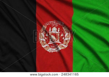 Afghanistan Flag Is Depicted On A Sports Cloth Fabric With Many Folds. Sport Team Waving Banner
