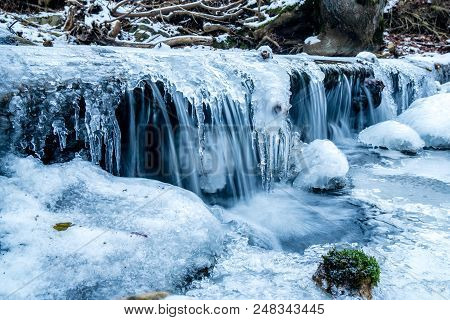 Frozen Stream Long Time Exposure In Siwtzerland