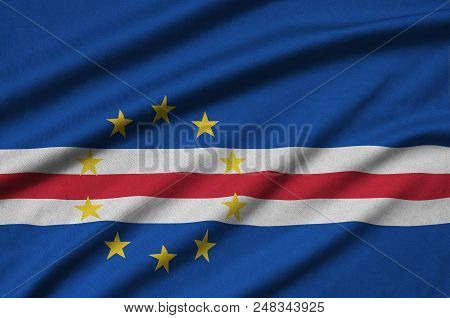Cabo Verde Flag  Is Depicted On A Sports Cloth Fabric With Many Folds. Sport Team Waving Banner