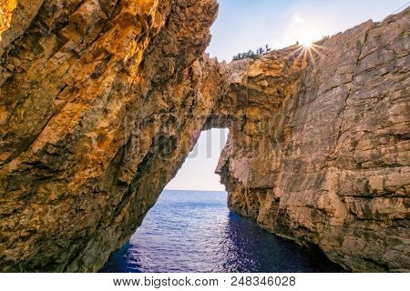 Landscape View Of Rocky Formations With Sun, Korakonissi In Zakynthos