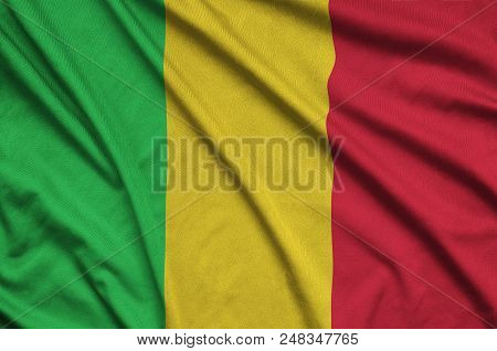 Mali Flag  Is Depicted On A Sports Cloth Fabric With Many Folds. Sport Team Waving Banner