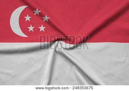 Singapore Flag  Is Depicted On A Sports Cloth Fabric With Many Folds. Sport Team Waving Banner