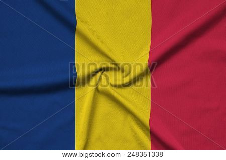 Chad Flag  Is Depicted On A Sports Cloth Fabric With Many Folds. Sport Team Waving Banner