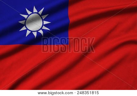 Taiwan Flag  Is Depicted On A Sports Cloth Fabric With Many Folds. Sport Team Waving Banner