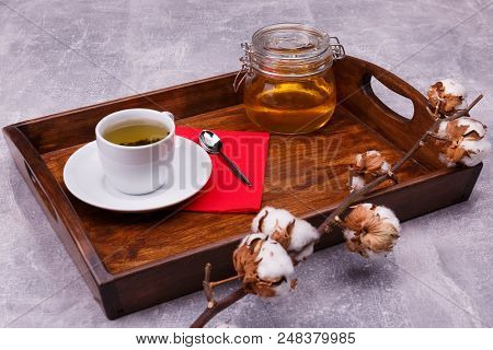 A Wooden Tray With Cutlery For Drinking Tea Consists Of A Saucer With A Cup Teaspoon Napkin Glass Po