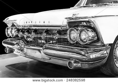 Athens, Attica / Greece - February 9, 2013: Crysler Imperial 1959 in black and white. Selective focus on the right headlights