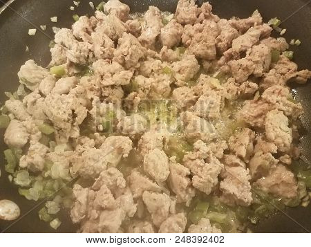 Seasoned Ground Turkey Meat Sizzing In A Frying Pan With Green Peppers