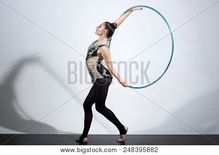 Woman Working Out With Hoola Hoop In Studio