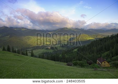 Photo Of Mountain Landscape In The Summer Under Beautiful Cloudy Sky. Ukraine, Carpathians, Dzembron