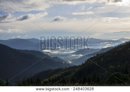 Photo Of Misty Morning Fog At The Sunrise In The Mountains. Ukraine, Carpathians, Dzembronia Village