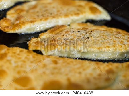 Spicy Juicy Gedza Dumplings With Meat Filling And Chinese Cabbage Fried In A Frying Pan Golden Crust