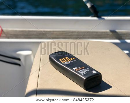 KEFALONIA, GREECE - JULY 5, 2018: Piz Buin factor 30 suncream in a bottle on a boat in Greece.