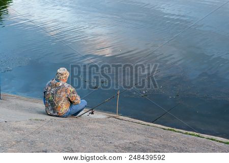 Elderly Man With Tattoo Sitting On Concrete Stairs And Thinking Near The Water, Sad Concept