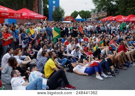 ST. PETERSBURG, RUSSIA - JUNE 17, 2018: Football fans watch the game at FIFA Fan Fest in Saint Petersburg during the FIFA World Cup Russia 2018. The city hosts 7 matches of FIFA World Cup