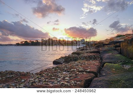 Landscape Of Rock Harbour During Sun Setting Time