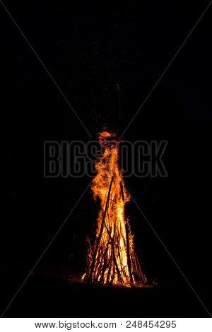 Midsummer Night. Young People In Slavic Clothes Sitting Near The Bonfire.