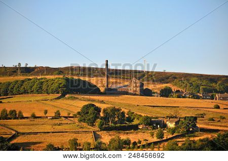 A Panoramic View Of The Village Of Old Town Near Hebden Bridge In West Yorkshire With Summer Sunshin