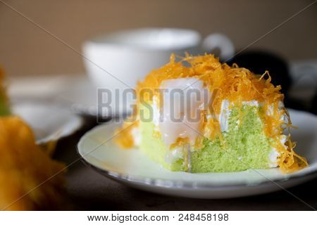 Close Up Selective Focus Piece Of  Gold Egg Yolk Thread Cake, Or Cake Foi Tong Thai Pandan Cake  Wit