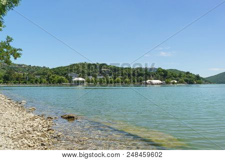 View Of The Central Embankment Of Lake Abrau With An Amphitheater. The Village Of Abrau-dyurso Is Th