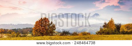 Amazing Autumn Landscape. Piatra Craiului Mountains In Sunset Light In Poiana Marului, Transylvania.