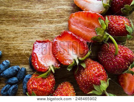 Beautiful Strawberry On A Wooden  Background. Organic Bckground