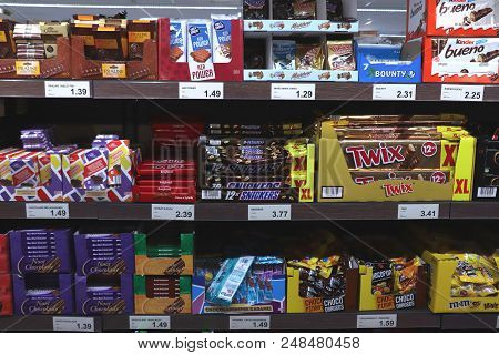 Ijmuiden, The Netherlands, July 4th 2018: Chocolates And Candy Bars In A Supermarket. Text On Tags: 