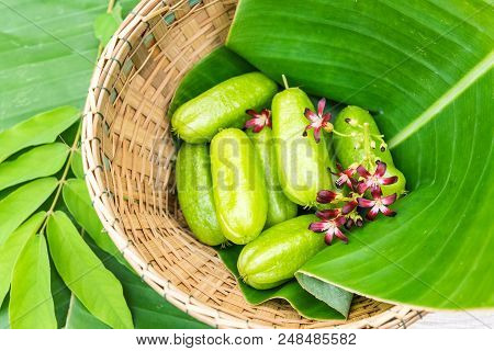 Averrhoa Bilimbi Fruit With Flowers On Banana Leaf