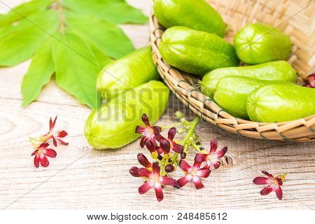 Averrhoa Bilimbi Fruit With Flowers And Leaf On Wood Background