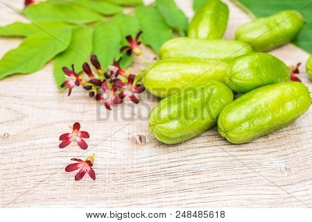 Averrhoa Bilimbi Fruit With Flowers And Leaf On Wood Background