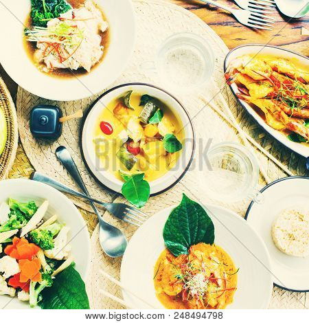 Table Top View Thai Traditional Cuisine. Pad Pak Ruam Mitr Stir Vegetables. Red Curry Chicken Coconu